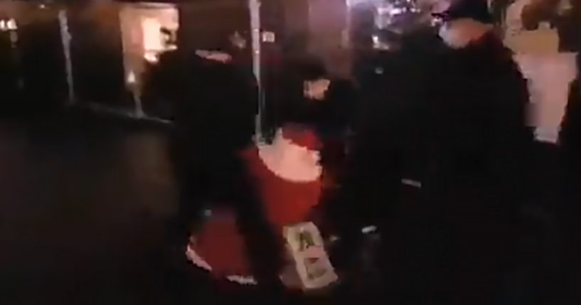 Santa Claus dragged away by police