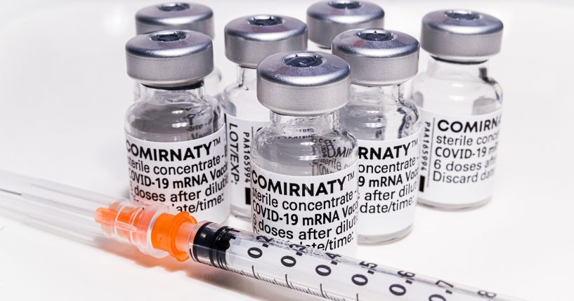 Vials marked Comirnaty with a syringe
